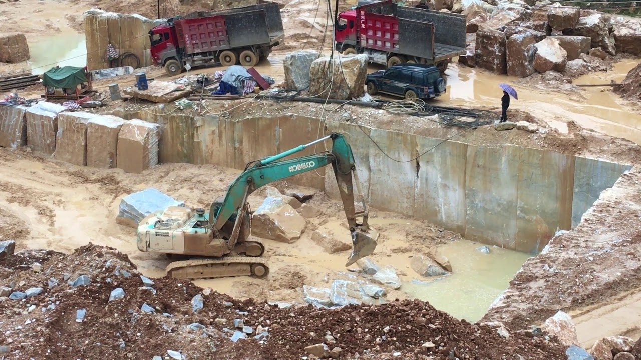 Poster frame from the company's own YouTube upload titled Unisun Stone Natural Marble Quarry