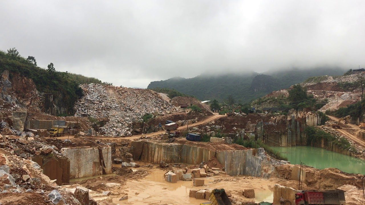 Poster frame from the company's own YouTube upload titled Unisun-Stone Company Natural Marble Stone Quarry