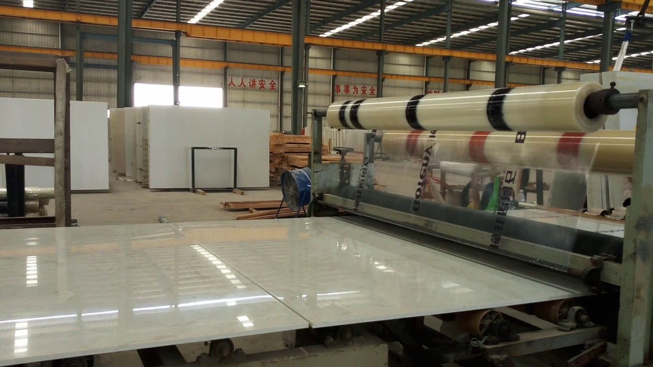 Poster frame from the company's own YouTube upload titled Engineered Stone Plastic film cover factory